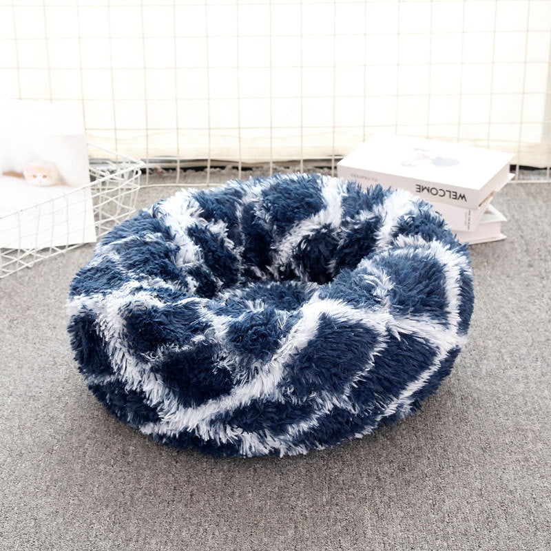 Blue and white checkered pet bed on a carpeted floor.