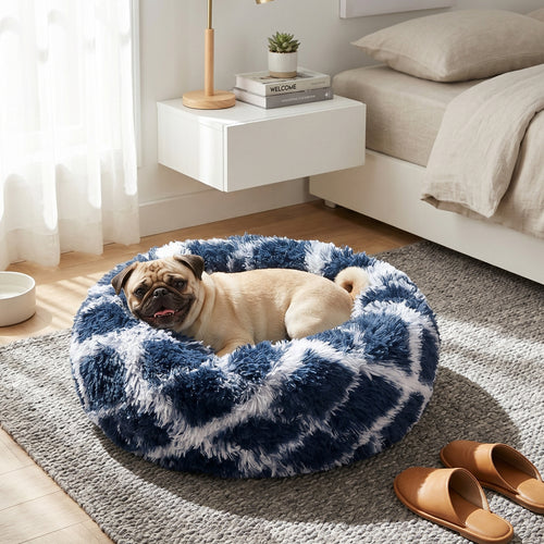 A sleepy Pug sinking into a soft AbbyPaw calming dog bed in a cozy living room.